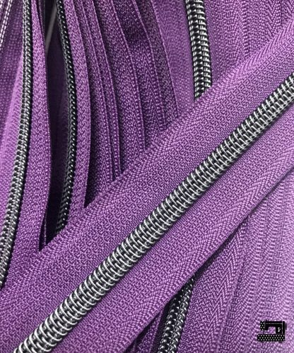 Zipper by the yard #5, Nylon Coil Metallic Gunblack on Eggplant Purple